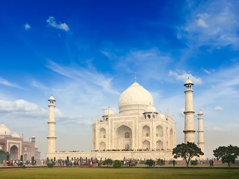 The Taj Mahal in Agra, India, under a blue sky