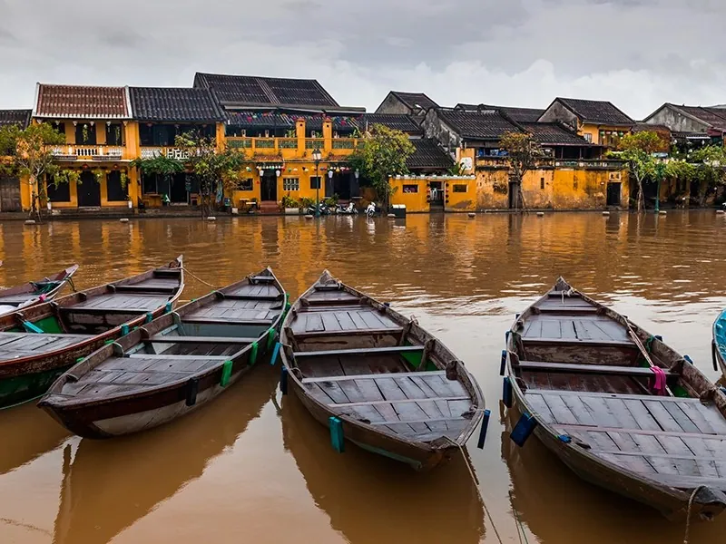 Boats beside the riverside buildings of Hoi An, Vietnam
